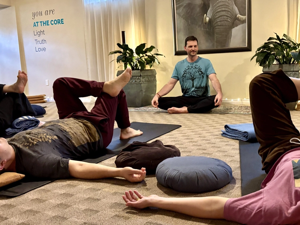 Yogesh from At The Core teaching a yoga class